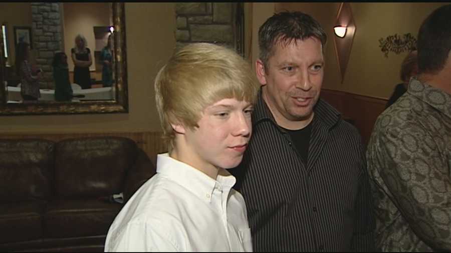 A Northern Kentucky father and son were honored Saturday night for rescuing a drowning girl from a pool last summer.