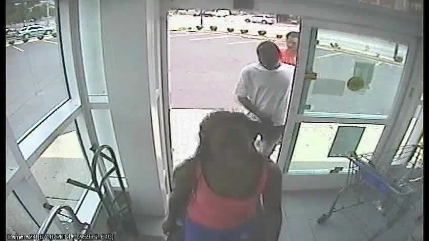 Police say Lashawnda Stevens is the woman in front and Antwan Hocker is in the red shirt at the back in this surveillance photo.