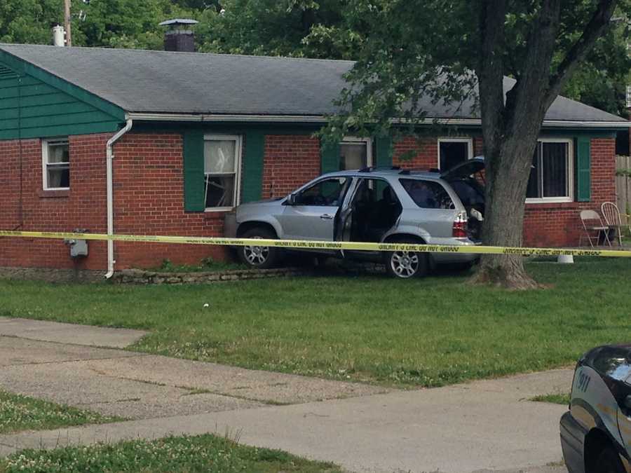 Photos: Person shot, car hits home