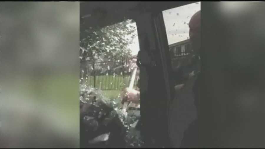 A cellphone video shows police in Indiana breaking a car window and using a stun gun on a passenger. The video was recorded by someone in the car who's suing Hammond police over a Sept. 24 confrontation.
