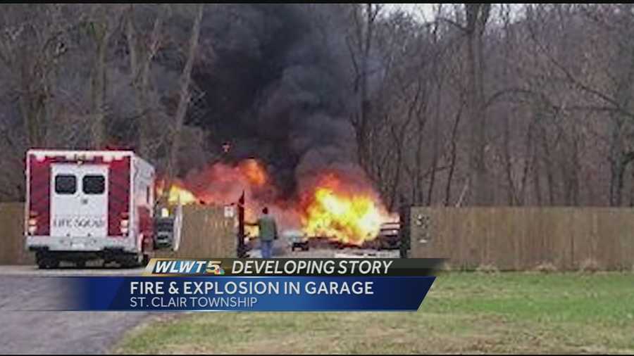 Neighbors in St. Clair Township said they were startled by two loud explosions after a garage exploded Wednesday afternoon on Fear Not Mills Road.
