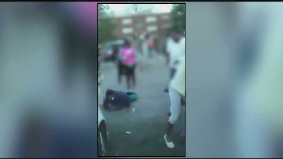In a video posted to Facebook, teens are seen fighting before a man steps in and starts attacking students.