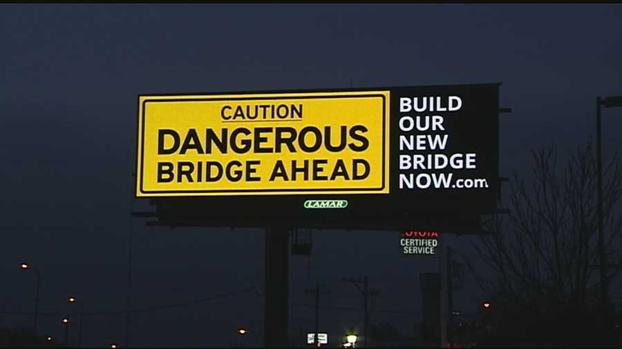 A new billboard posted alongside the northbound lanes of I-75 just before the Brent Spence Bridge cautions drivers of a "dangerous bridge ahead." It's causing quite the controversy.