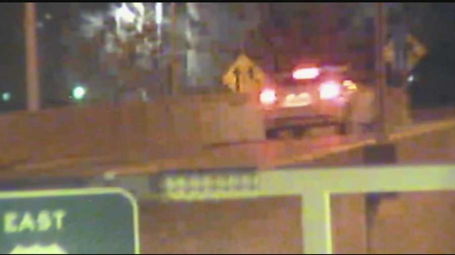 The images, taken at 12:56 a.m. on Dec. 27, show a 2013-2015 white Ford Fusion sedan on Fort Washington Way, about to get onto the entrance ramp of Interstate 71 around the time one of the shootings took place.