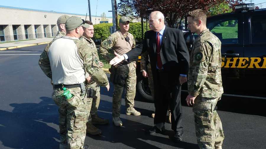 Jones sees off the SWAT members from the sheriff's office parking lot earlier this week.