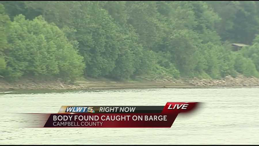 A man's body was recovered between two barges along a rocky ridge of the Ohio River.