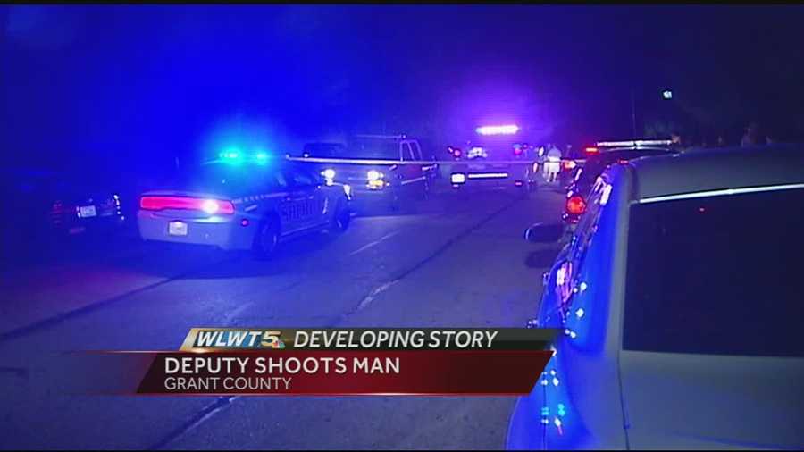 A man is hospitalized after troopers said he opened fire on a Grant Co. deputy.