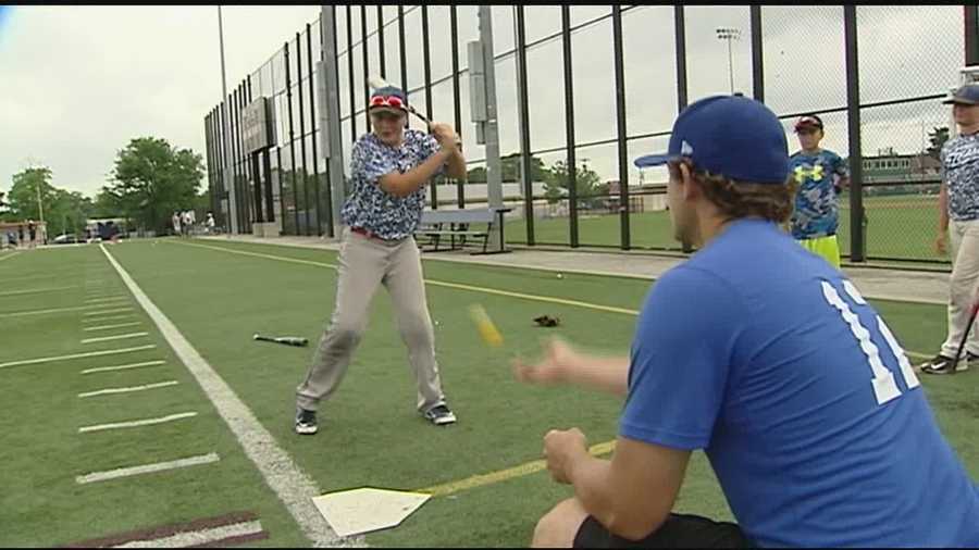 About 100 students from Cincinnati took part in a baseball summer camp with members of the Cincinnati Police and Fire Departments.
