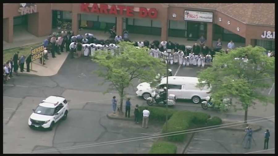 Fallen Cincinnati Police Officer Sonny Kim was laid to rest Friday. One of the most touching moments along the route was when Kim's hearse past his karate dojo where dozens of students and parents stood.