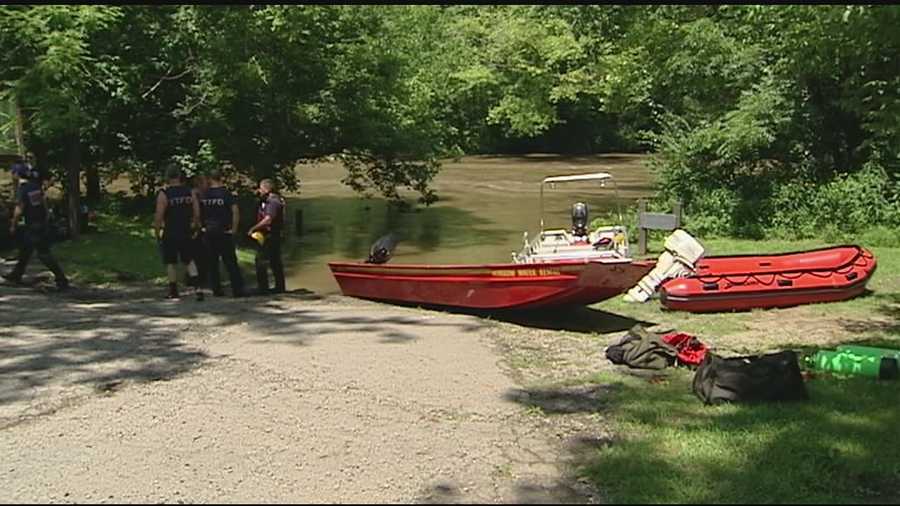 Dispatchers said the two were clinging to a tree in the river near Corwin Road near Oregonia just after noon.