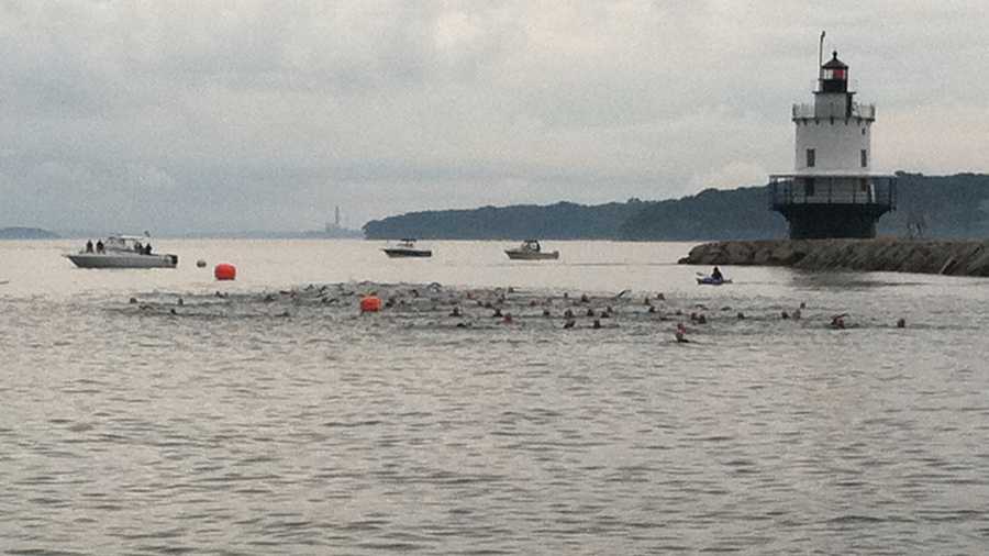 The first group of swimmers is off.