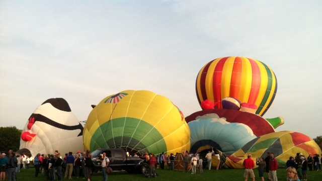 Several balloons being inflated and getting ready to launch