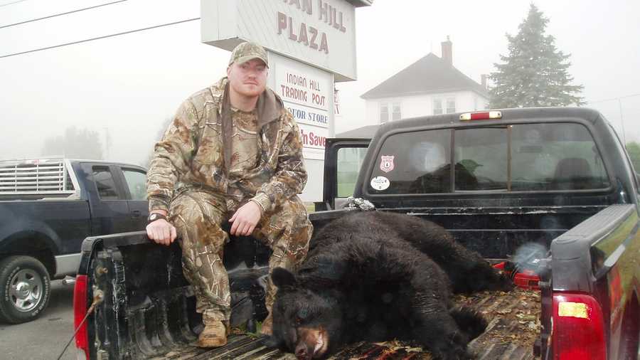 Matt Knox of Waynesboro, Pennsylvania and his bear catch weighing in at a record 699-pounds.