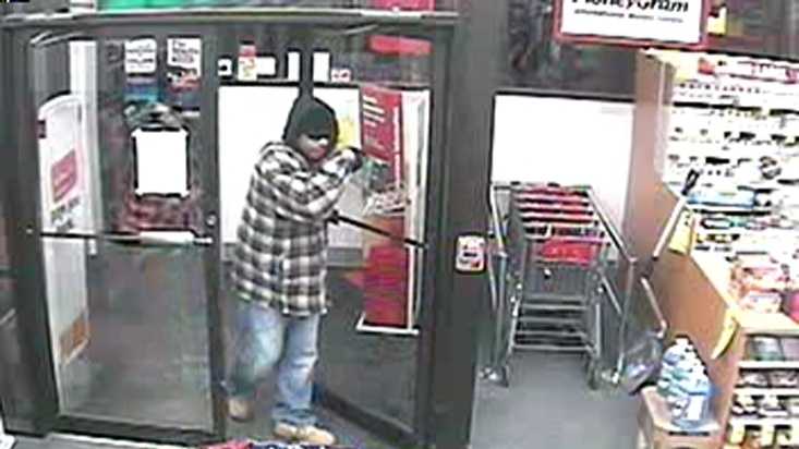 The suspect depicted in this surveillance picture from the Jan. 17 robbery at CVS on Forest Avenue is described as a black man, about 6' tall in his 30s or 40s.