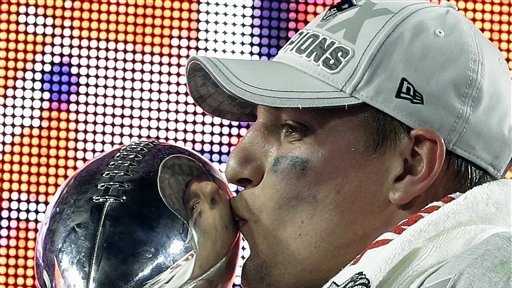 New England Patriots tight end Rob Gronkowski kisses the Vince Lombardi Trophy