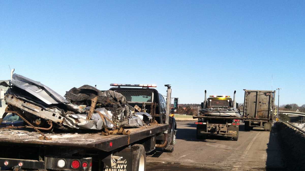Photos Crushed cars fall off truck on busy highway