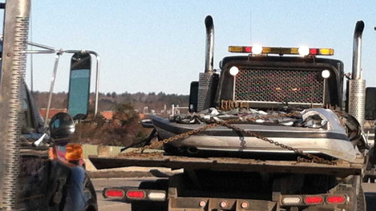 Photos Crushed cars fall off truck on busy highway