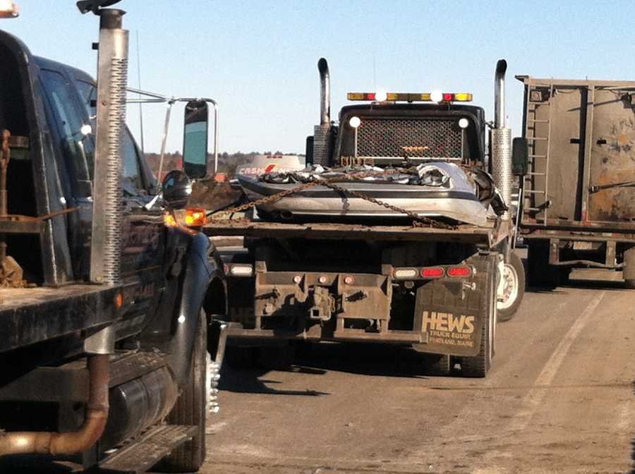 Photos Crushed cars fall off truck on busy highway
