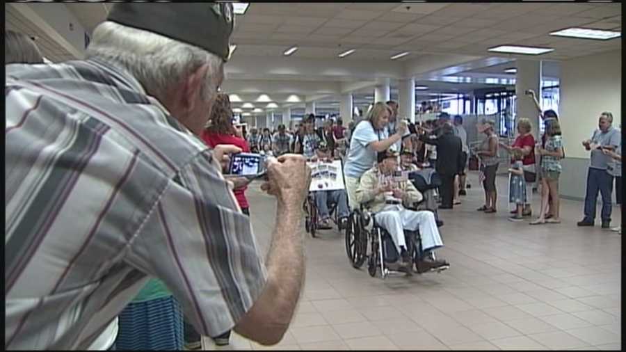 Hundreds of people welcomed veterans home at the Portland Jetport for Operation Welcome Wagon.
