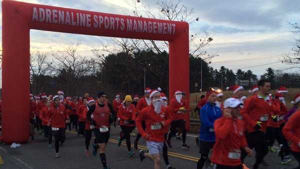 Sea of Santas hustle for Easter Seals Sunday in South Portland