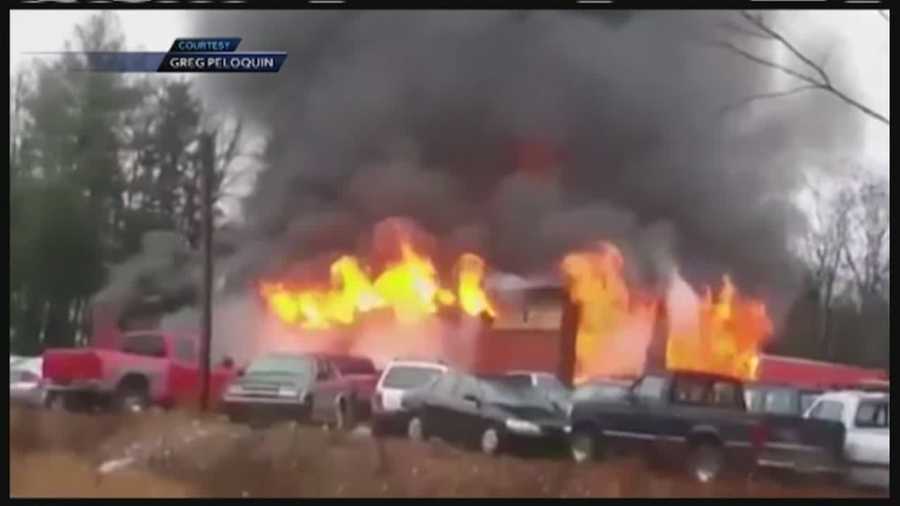 A fire destroys Ovide's Used Cars on Route 302 in Bridgton Thursday.