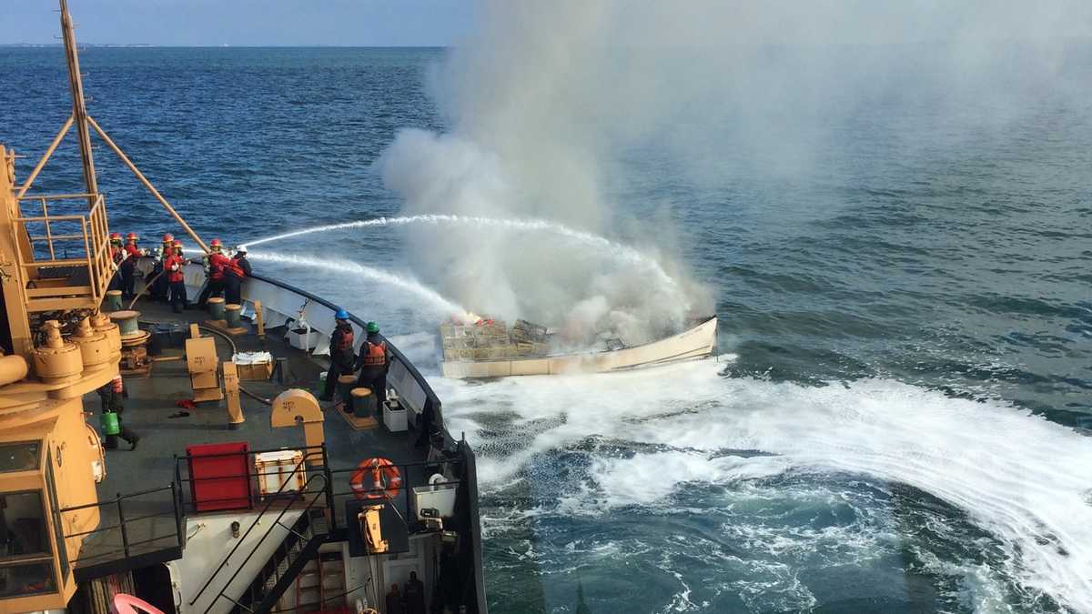 Fishermen rescued after ship catches fire