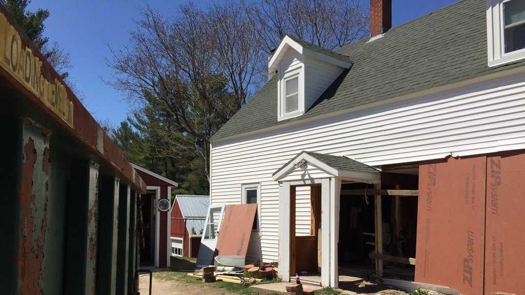 Woman trapped in home after truck slams into farmhouse