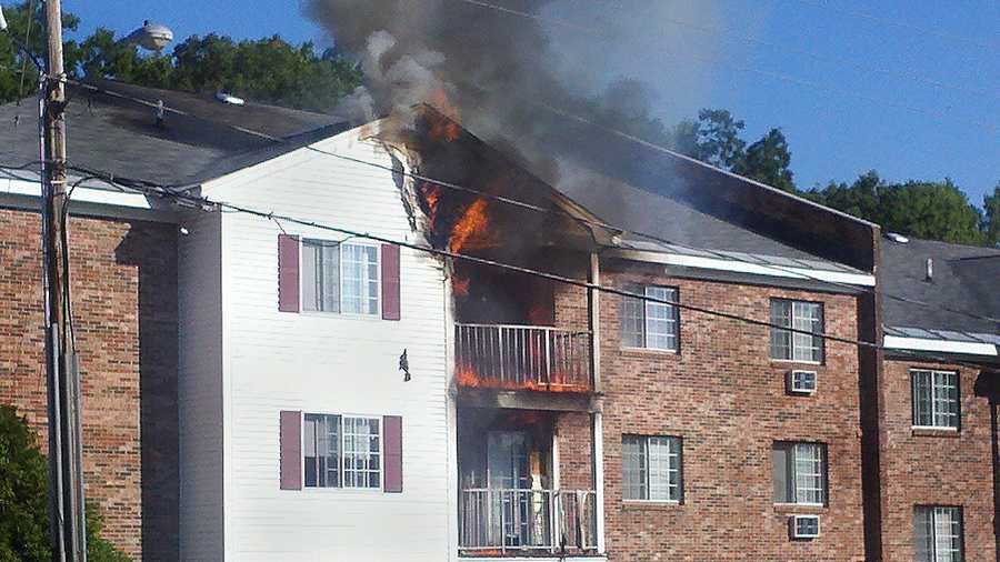 Firefighters in Manchester battle a blaze at an apartment building fire Sunday morning.