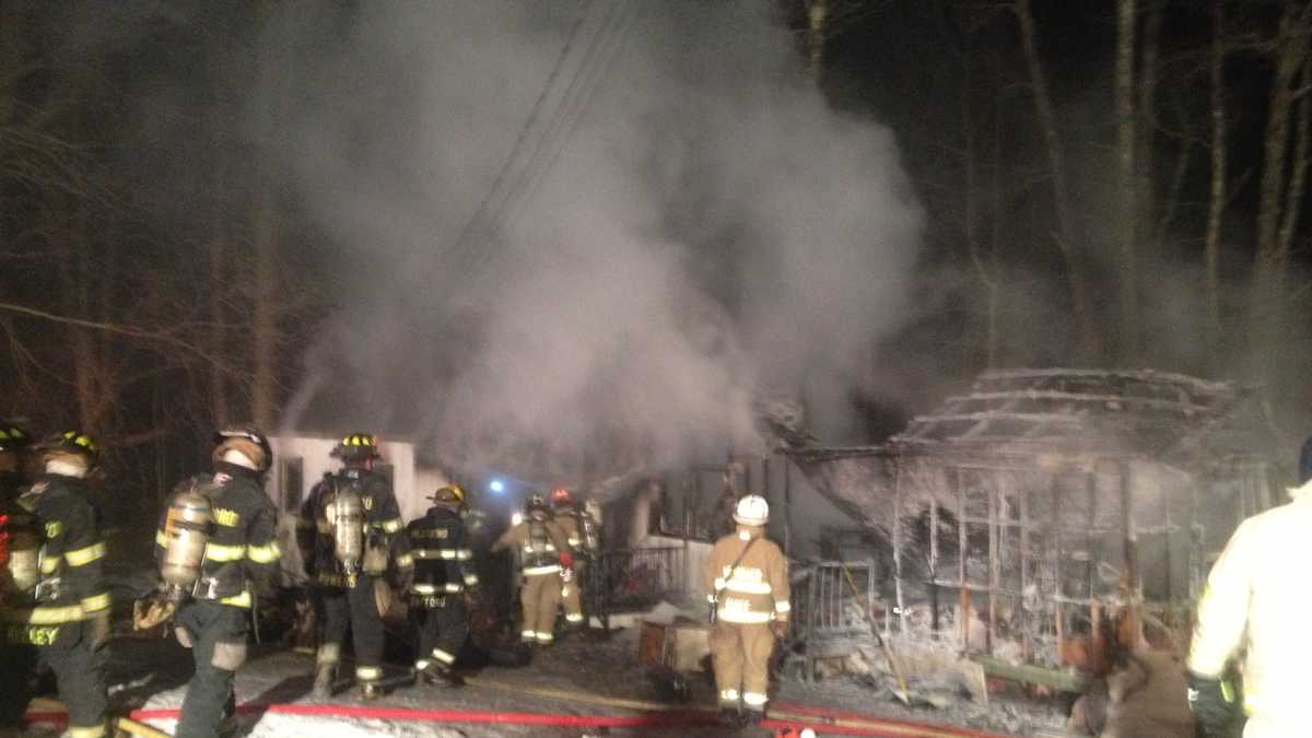 One person in hospital after fire destroys home
