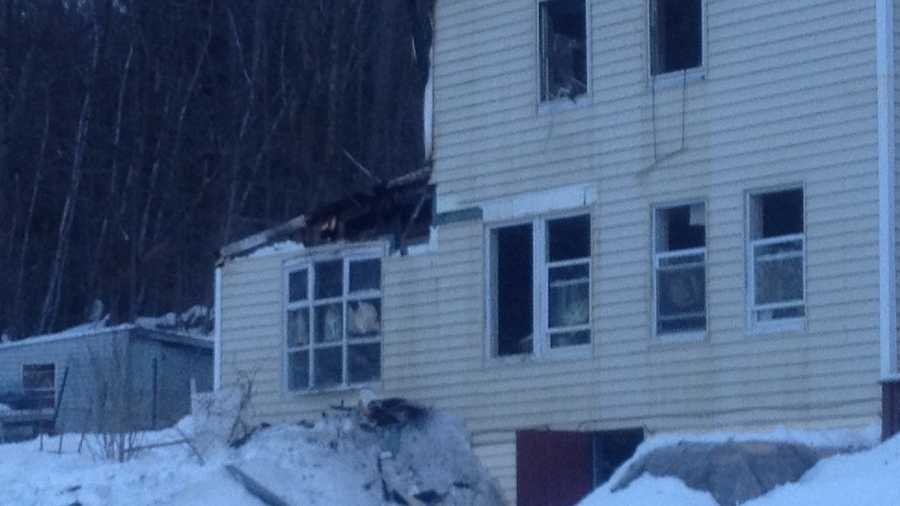 Flames burned through a Pittsfield house early Friday morning