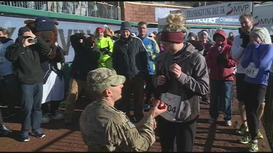 A Bedford woman got a big surprise at the finish line of the Turkey Trot on Thanksgiving, where her boyfriend, Army Specialist Jeff Glaude, was waiting for her.