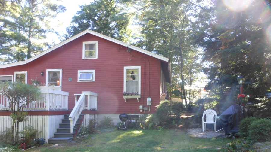 Located in a quiet cove on Lake Winnipesaukee is a 1960s era cottage for rent, which sleeps six. 