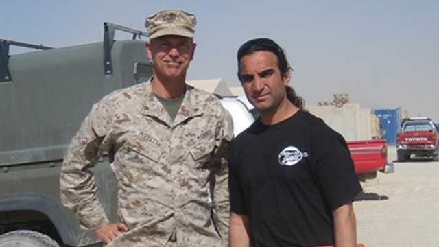 Lt. Col. Mike Moffett of Concord in Afghanistan with Fahim Fazli in 2010.