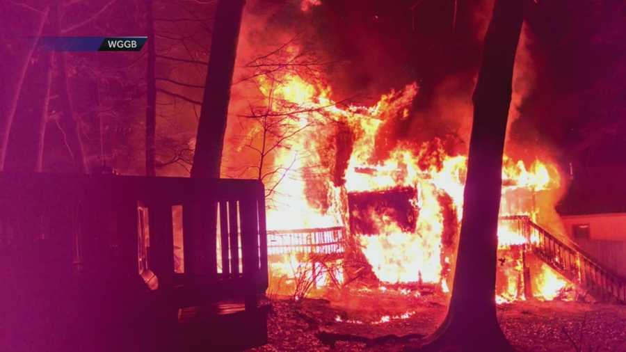 A mother rushed back into her burning home to rescue her infant child on Christmas Eve in Southwick.