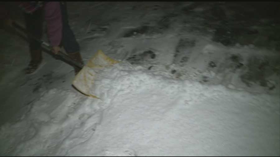 Granite Staters shovel the snowy mess Saturday evening.