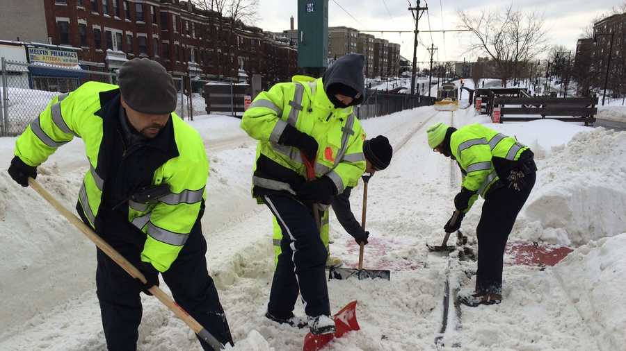 MBTA employees shovel out Green Line Tracks in Brighton on Tuesday, Feb. 10., 2015.