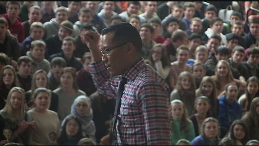 A Grammy-winning music teacher from Windham returned home Wednesday to a hero's welcome.