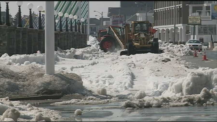 State and town crews Thursday hauled away much of the snow remaining in Hampton Beach after a harsh winter.