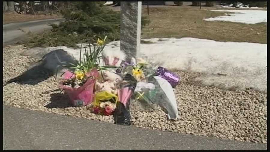 A growing memorial has formed outside a Bedford home where, investigators said, a mother shot her two daughters before turning the gun on herself.