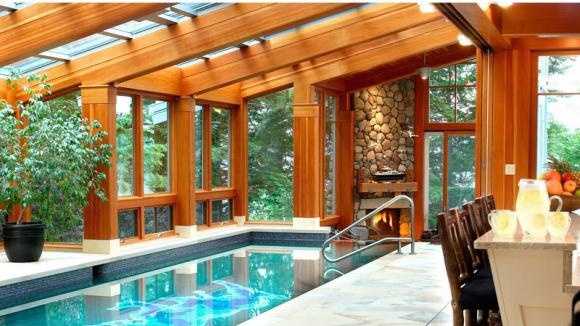 Mansion Monday: Modern lakeside home with indoor pool. waterfall