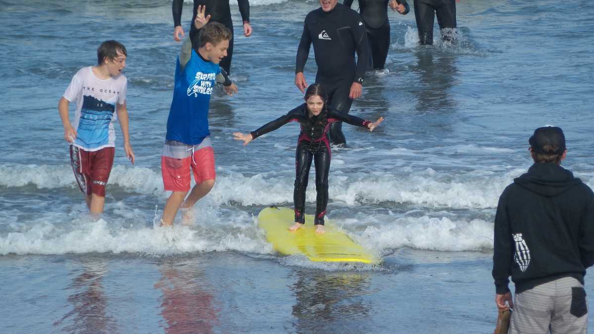 Surfing with Smiles helps children with special needs learn to surf