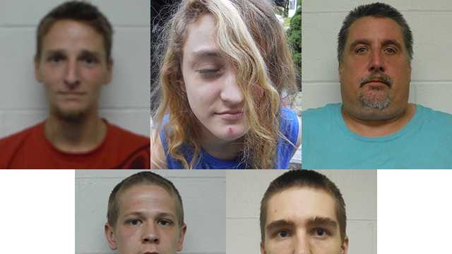 Five people faces charges after police seized heroin and drug paraphernalia from a home in Pembroke on Wednesday.
