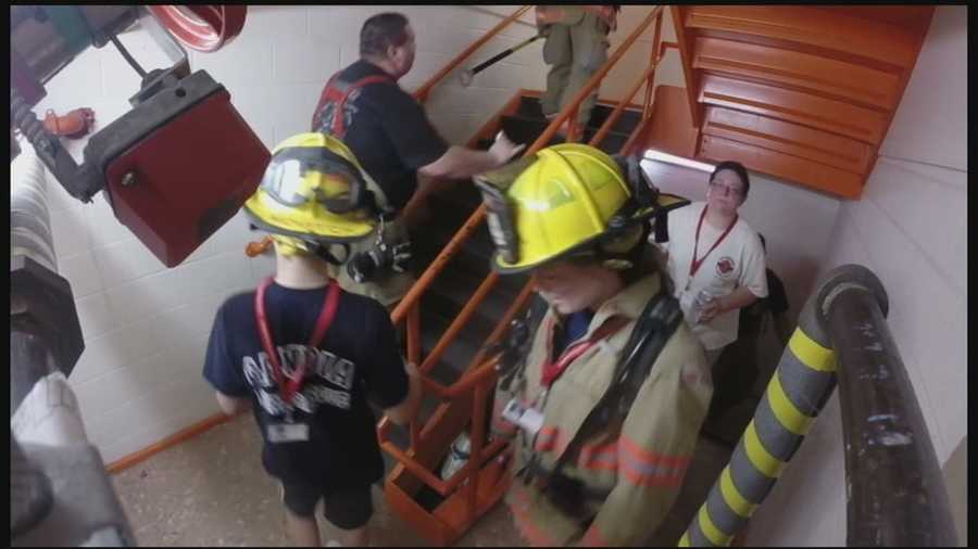 Firefighters and locals climb stairs at Brady Sullivan tower to honor victims of 911.