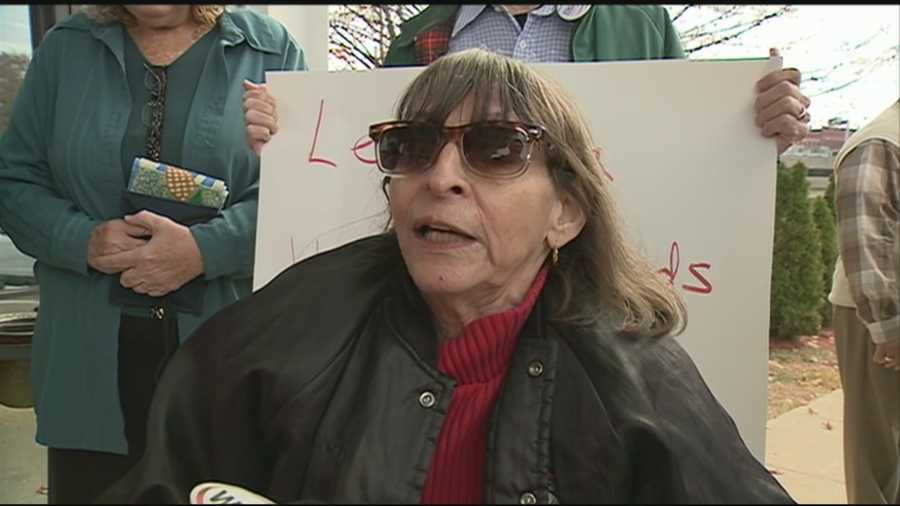 An Alstead woman with advanced lung cancer is suing New Hampshire's health commissioner in hopes of getting a medical marijuana identification card before dispensaries are opened.