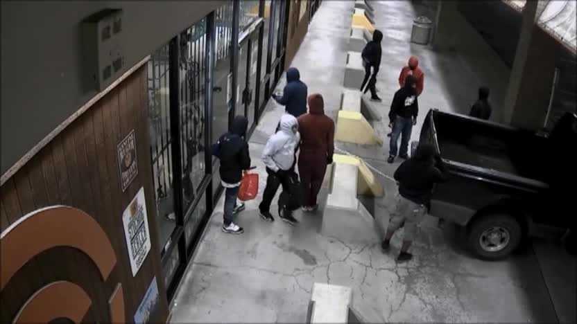 A very detailed surveillance video shows a group of robbers breaking into a gun store in Houston, Texas.