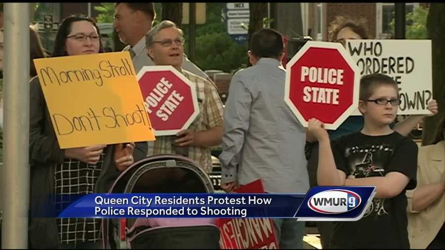 A group of West Side residents gathered outside City Hall Tuesday night to protest how the city responded to the shooting of two officers last month.