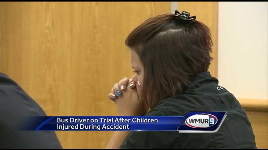 A trial began Tuesday for a bus driver accused of crashing her bus with students on board while she was downloading an app for her phone.