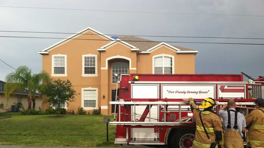 Firefighters say lightning struck this house in Port St. Lucie, causing the roof to catch on fire. (Erin Guy/WPBF)