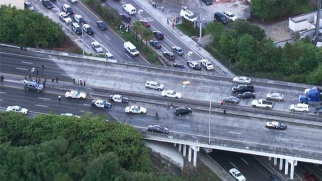 Authorities say two officers were shot on Florida's Turnpike in Broward County before the gunman fatally shot himself.