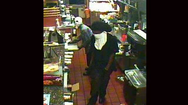 Two masked gunmen robbed a McDonald's in Oakland Park late Saturday night.